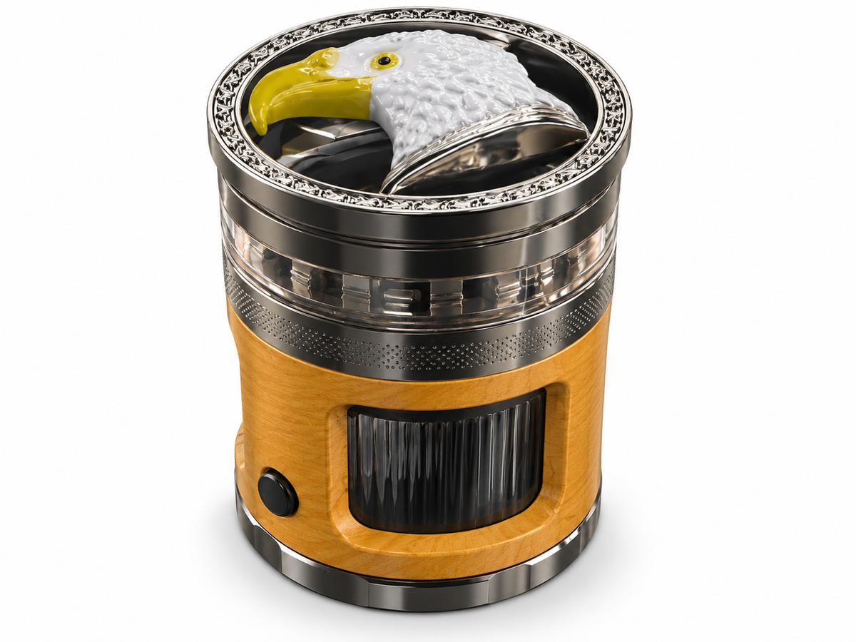 Crushers GR904 Gold finish eagle herb grinder with golden tan body, dark metal trim and storage window on white background