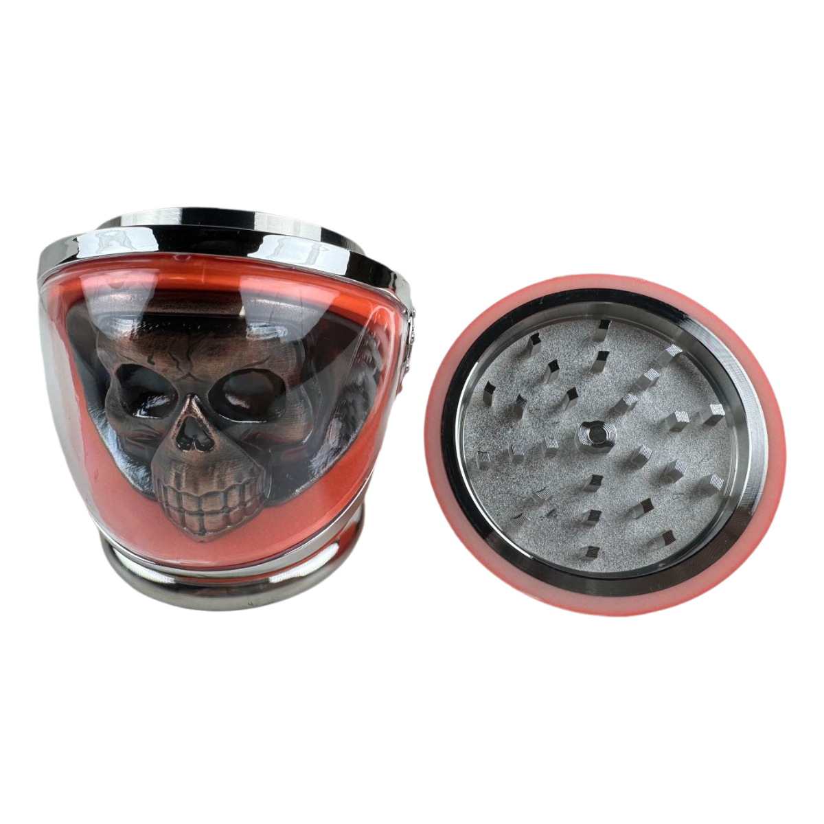 Orange skull helmet grinder with lid removed showing grinding teeth