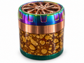 Mottled brown herb grinder with copper wheel-style lid and rainbow grip rim on white background