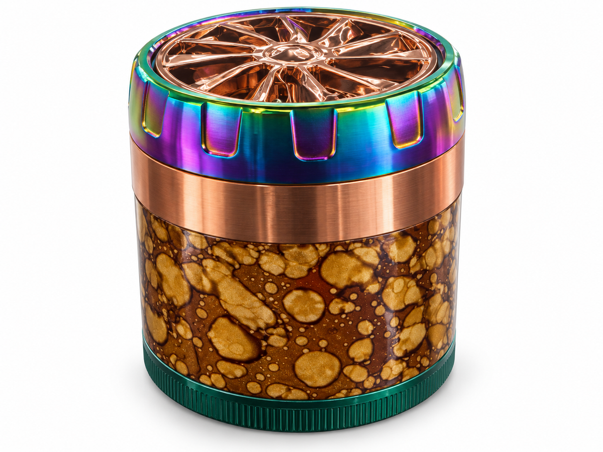 Mottled brown herb grinder with copper wheel-style lid and rainbow grip rim on white background