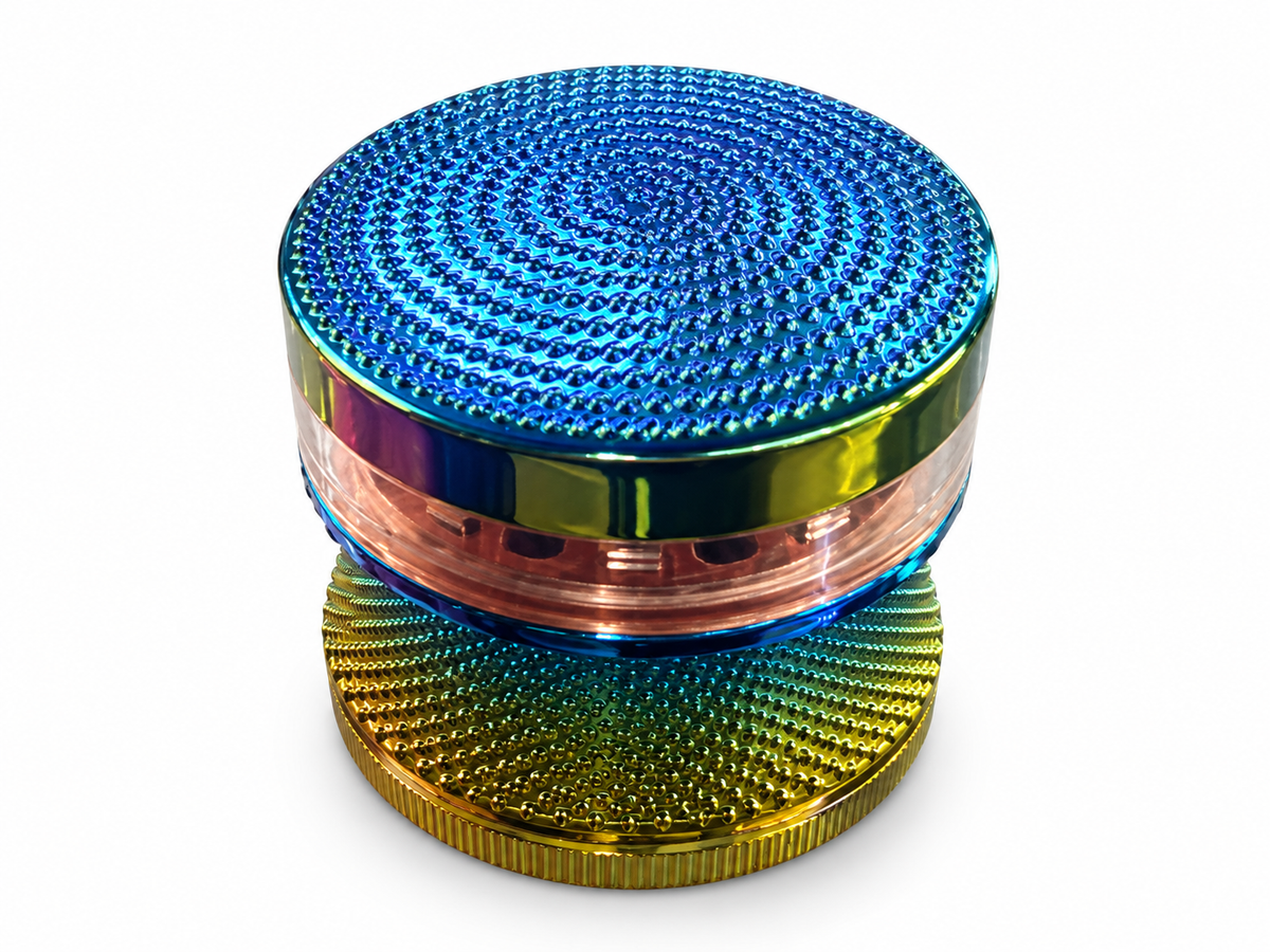 Blue textured rainbow four-piece herb grinder with clear band and gold-green body on white background