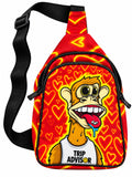Red and yellow heart-pattern sling bag with Trip Advisor cartoon monkey artwork and adjustable black strap on a white background